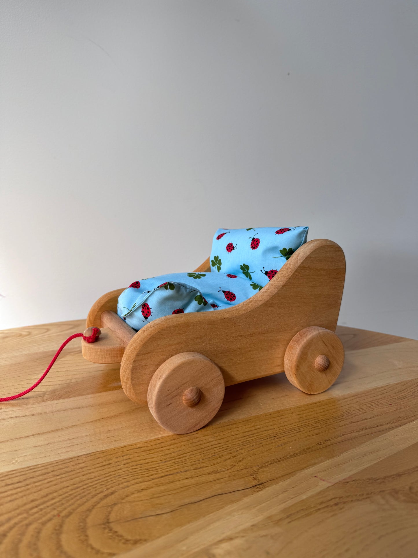 Children's Wooden Tow Around Doll Trolley